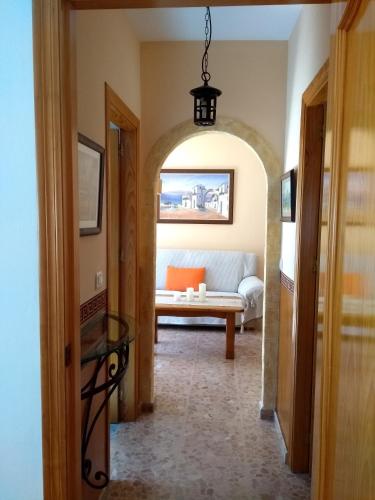 a hallway with a living room with a couch at MARIANS in Salobreña