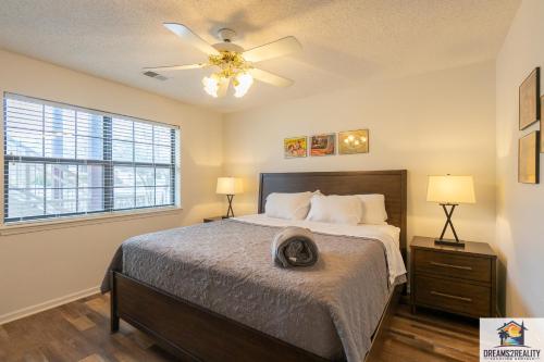 a bedroom with a bed and a ceiling fan at 2BR Walk-In Condo - Near the 76 Strip - 2 Pools - FREE TICKETS INCLUDED - FHD-8 in Branson