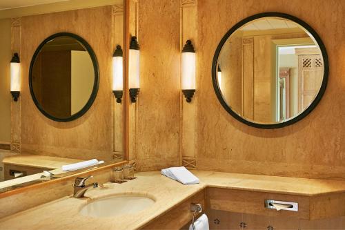 a bathroom with a sink and a mirror at Sheraton Soma Bay Resort in Hurghada