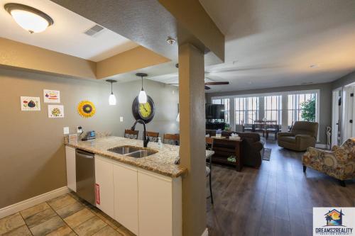 a kitchen and living room in a apartment at 2BR Walk-In Condo - Near the 76 Strip - Pool - FREE TICKETS INCLUDED - CLC-6 in Branson