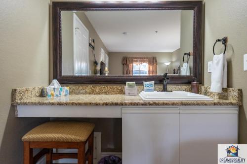 a bathroom with a sink and a mirror at 2BR Walk-In Condo - Near the 76 Strip - Pool - FREE TICKETS INCLUDED - CLC-6 in Branson