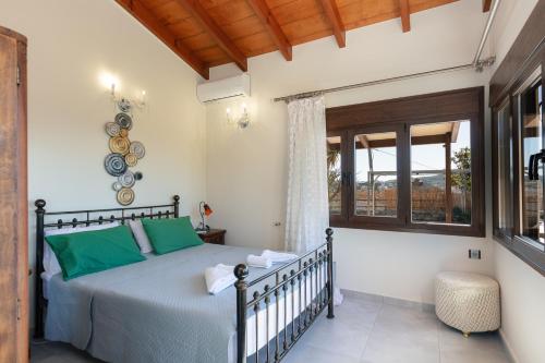 a bedroom with a bed and a window at Family Villa Ellis Plakias with private pool 200m to the beach walking distance to the amenities in Plakias
