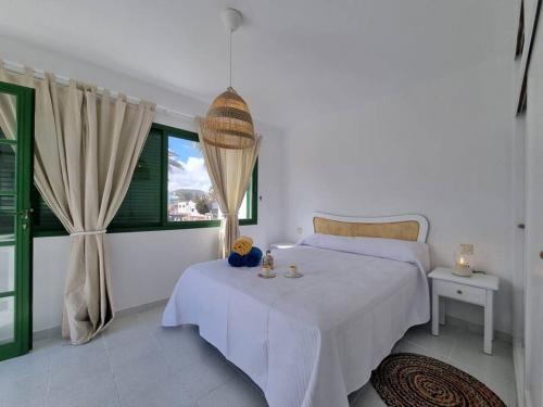 Postel nebo postele na pokoji v ubytování La Casa de Las Palomitas