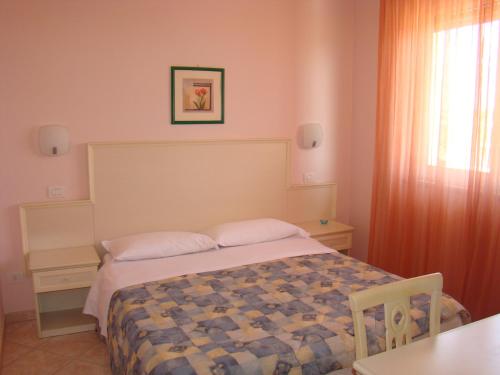 Ένα ή περισσότερα κρεβάτια σε δωμάτιο στο Il Casale