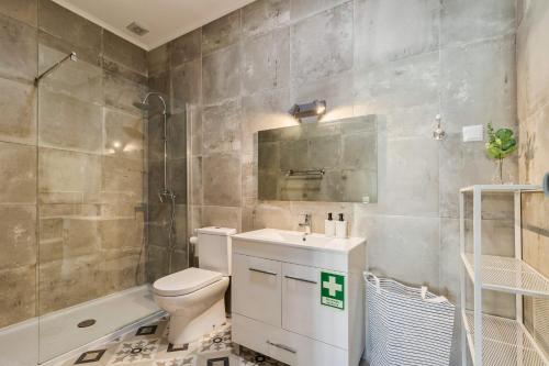 a bathroom with a toilet and a sink and a shower at A Casa Amarela de Sintra in Sintra