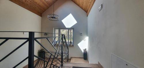 a staircase in a house with a vaulted ceiling at Zajazd Stronie in Stronie Śląskie