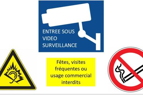 a sign for a video surveillance facility with a no smoking sign at A2D Bel appartement, Nancy Thermal in Nancy