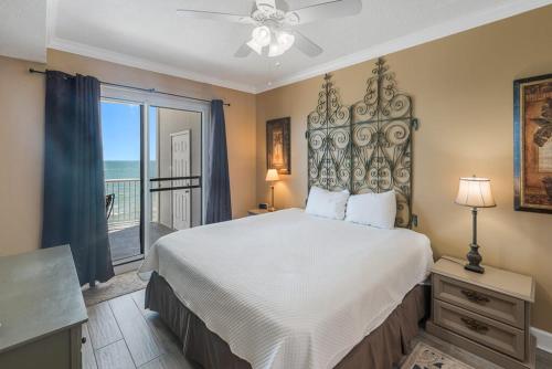 a bedroom with a large bed with a view of the ocean at Island Royale 1002 by ALBVR - Come & relax at our beautiful beachfront condo in the heart of Gulf Shores! in Gulf Shores