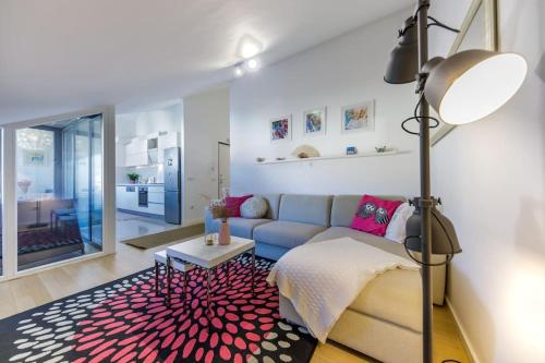 a living room with a couch and a rug at Apartman Merita in Dubrovnik