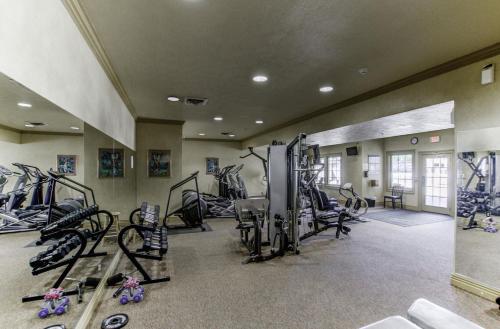 a gym with treadmills and machines in a room at 1BR Walk-In Condo at Pointe Royal - 2 Pools - FREE TICKETS INCLUDED - PR40-9 in Branson
