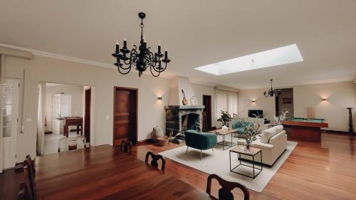 a living room with a couch and a fireplace at Chalet De La Croix in Vila Franca do Campo