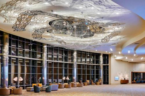 a lobby with a ceiling with a painting on it at Marriott Marquis San Diego Marina in San Diego