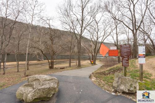 a park with two large rocks on the side of a road at 3BR Condo with Lake View - Trout Fishing - Playground - 2 Pools - Stairs Required - FREE TICKETS INCLUDED - PR69-9 in Branson