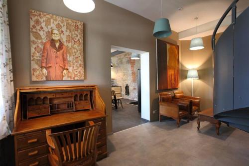 a living room with a large painting on the wall at Swiss villa in the Danube Bend in Nagymaros