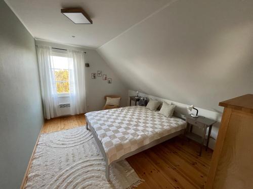 Ein Bett oder Betten in einem Zimmer der Unterkunft Kivika