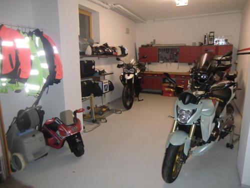 a garage with two motorcycles parked in it at Landhotel Flöhatal in Heidersdorf