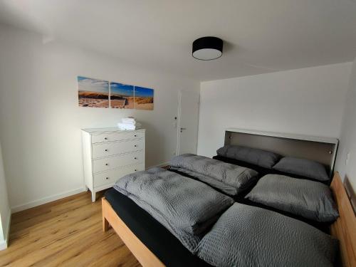 Ένα ή περισσότερα κρεβάτια σε δωμάτιο στο Ferienwohnung in Lütjenburg/Ostsee zu vermieten