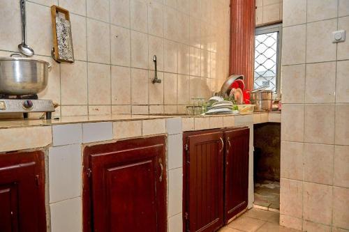 a kitchen with a sink and a counter top at Face Nal in Douala