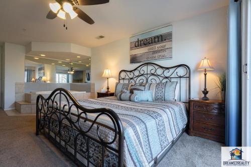 a bedroom with a large bed and a mirror at 1BR Walk-In Condo with 2 Person Jacuzzi Tub - Near the Strip - FREE TICKETS INCLUDED - CH5-3 in Branson
