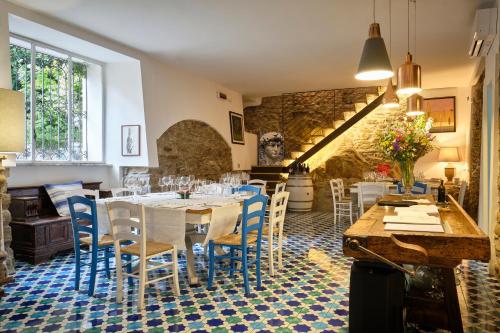 a dining room with a table and chairs at Palazzo Gentilcore in Castellabate