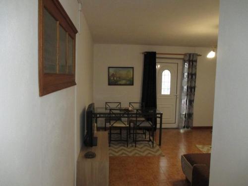 a living room with a dining room table and chairs at Casa Valente in Macedo de Cavaleiros