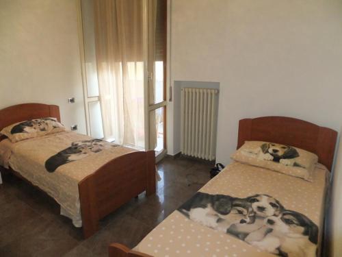 En eller flere senge i et værelse på Roseto degli Abruzzi Apartment