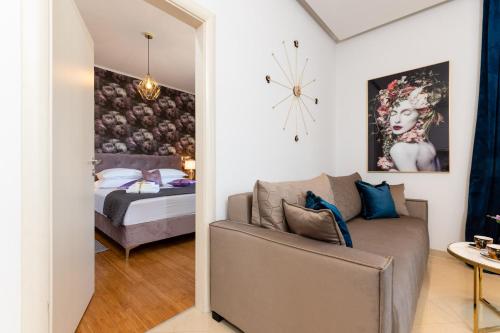 a living room with a couch and a bed at Luxa 5 min old town, 10 min airport in Trogir