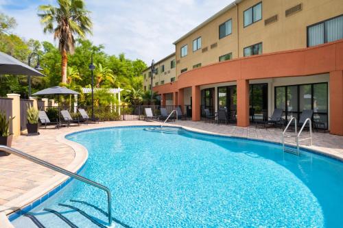 a swimming pool in front of a hotel at Fairfield Inn & Suites Orlando Ocoee in Orlando