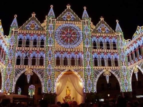 a building decorated with christmas lights in front of it at B&B Romeo in Bari
