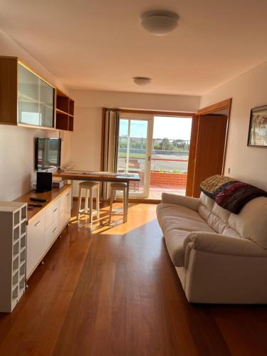 a living room with a couch and a table at Solmar in Moledo