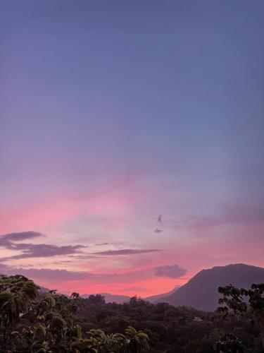 a view of a sunset with a mountain in the background at Frana Lodge in El Zaino