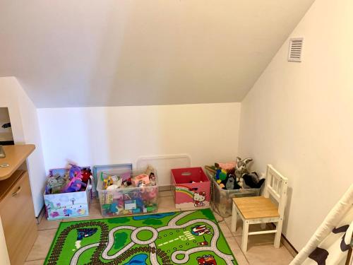 a childs room with toys and a table at Penzion Villa Verde Moravia in Klentnice