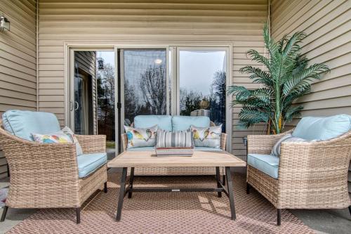 two chairs and a coffee table on a patio at 2BR Condo - Dock for Fishing - Jacuzzi Tub - FREE TICKETS INCLUDED - MJ4-130 in Branson