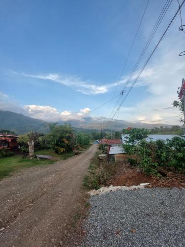 a dirt road next to a body of water at Jessie's Country House Rivas in Rivas