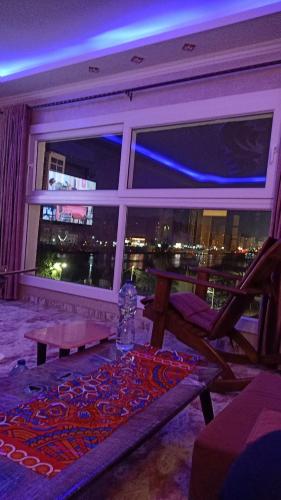 a room with a window with a view of the city at Nile Riviera in Mansoura in Mansoura