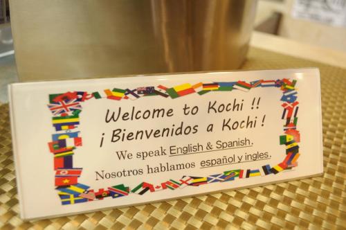 a sign that says welcome to kotaklezlezlezlezlezlezlez at Hotel Los Inn Kochi in Kochi