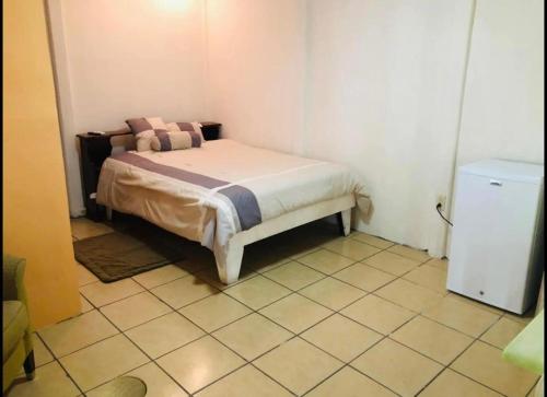 Apartamentos Zamora tesisinde bir odada yatak veya yataklar