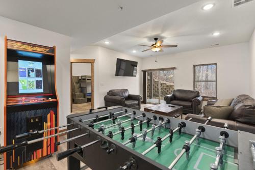 a living room with a pool table and a video game at 3BD Walk-In Near Silver Dollar City - Game Room - Pool - FREE TICKETS INCLUDED - RR-93B in Branson