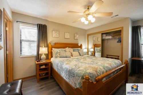 a bedroom with a bed and a ceiling fan at Lake View! Walk-In 3 BR Condo - Outdoor Pool - FREE TICKETS INCLUDED - TRH6-6 in Branson