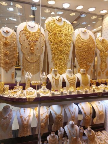 a display case in a store filled with gold jewelry at Sunrise Dubai in Dubai