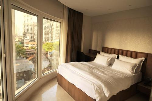 Postel nebo postele na pokoji v ubytování HOTEL ANUPAM RESIDENCY