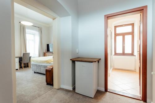 a room with a door leading to a bedroom at Botanický dvor in Banská Štiavnica