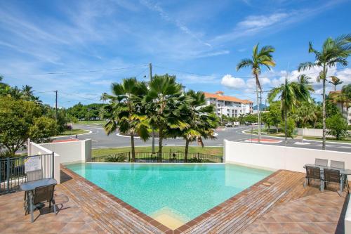 a swimming pool in the middle of a building at Belle Escapes 404 The Edge with Views in Cairns