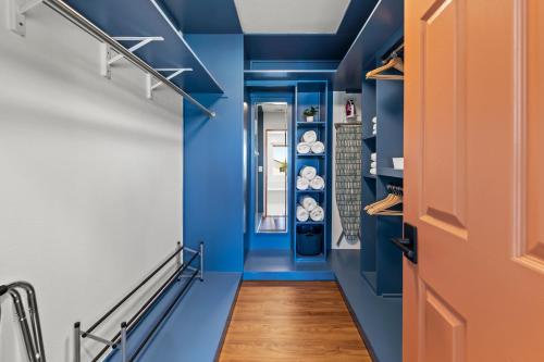 a hallway with blue walls and a blue ceiling at Spacious Private Home with Saltwater Pool & Hot Tub in Coachella