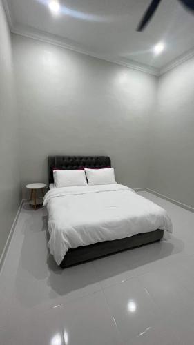 Ένα ή περισσότερα κρεβάτια σε δωμάτιο στο El Manzil Homestay with Pool