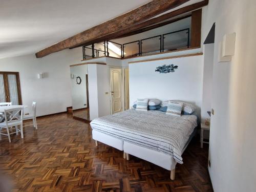 a bedroom with a bed and a table in it at Blue Windows in Camogli