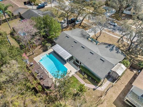 an overhead view of a house with a swimming pool at Spacious & Amazing Home w/ Big Pool and Patio in Brandon