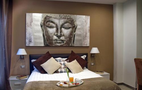 A bed or beds in a room at Gregori Guest House