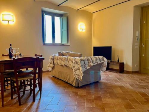 a living room with a couch and a table at Sangi Chianti Vacations in Poggibonsi