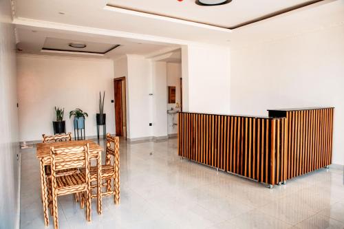 a dining room with a table and chairs at Senita Bed & breakfast in Kigali